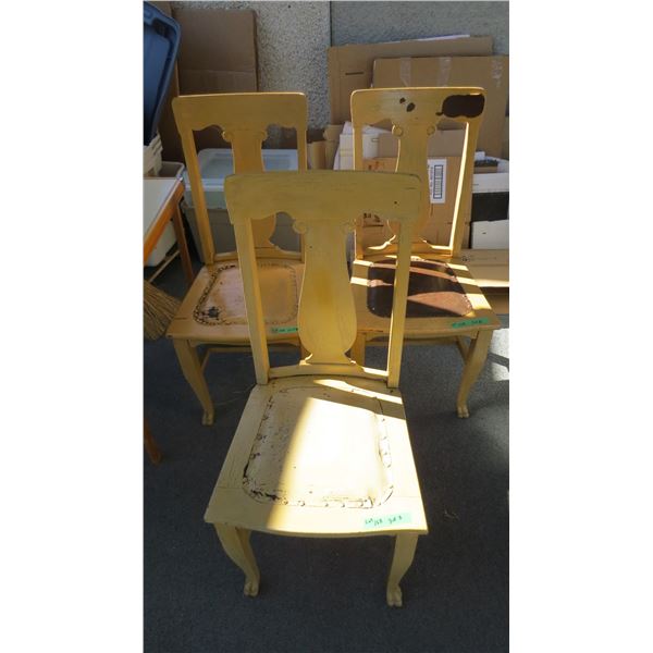 (3) Wooden dining chairs with leather seats (one needs repair)