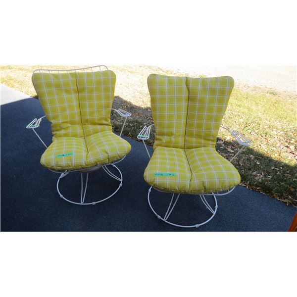 (2) Swivel patio chairs with cushions (cushions have a slight musty odour)