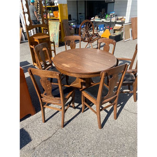 Antique oak table and 6 chairs and three leaves