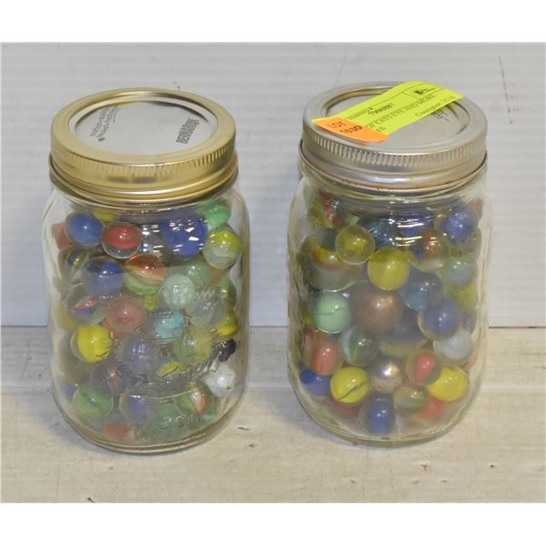 2 JARS OF CATS EYE AND MORE MARBLES