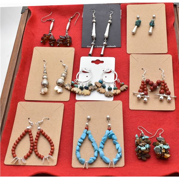 9 Pairs of Earrings by Larry McLelland