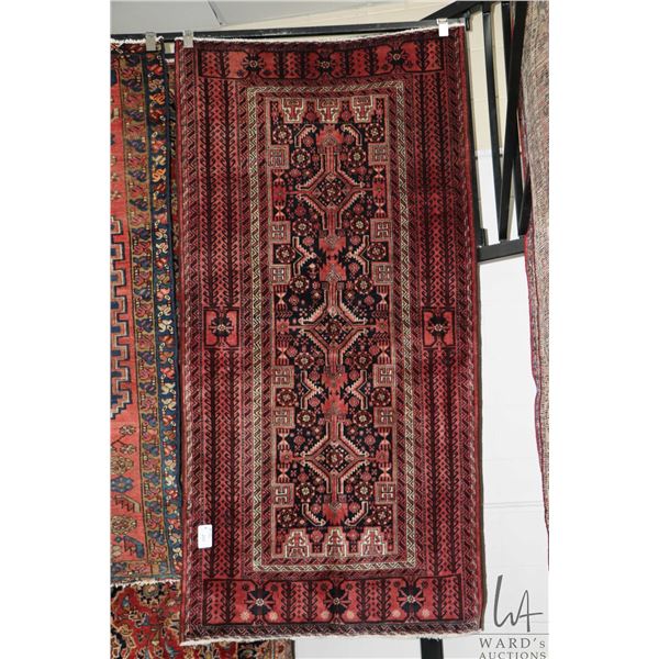 100% Iranian wool carpet  Baloch  with center medallion, multiple borders, red background and highli