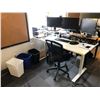 Image 1 : Group of office furniture including a wide adjustable sit and stand desk, a chair, and three small b
