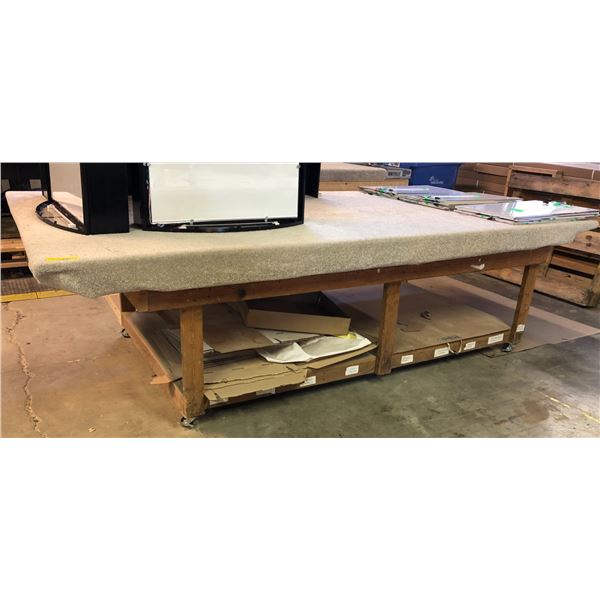 Custom made heavy duty wooden table w/ casters (approx. 10ft 2in long x 5ft 2in wide x 3ft height)