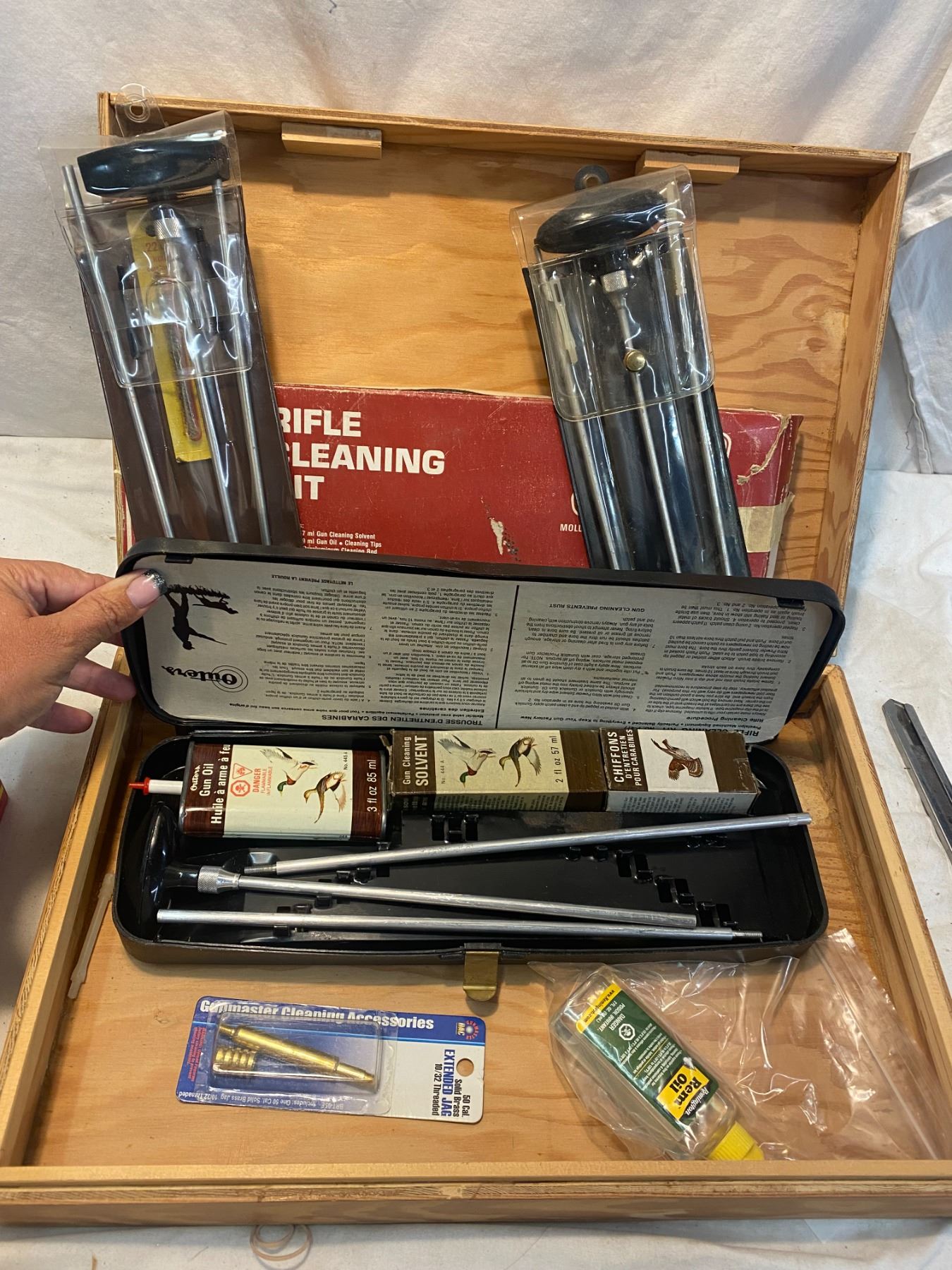 Gun cleaning kits in wood box