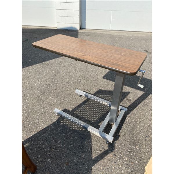Adjustable table on wheels