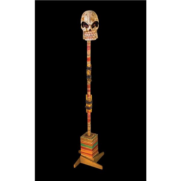 CEREMONIAL POST - CARICATURED HUMAN SKULL.