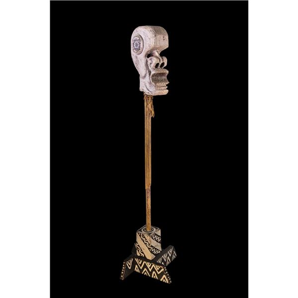 CEREMONIAL POST - CARICATURED HUMAN SKULL.