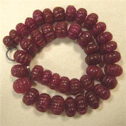 472 CTS CARVED GLASS FILLED COLOR ENHANCED RUBY STRAND 17-10 MM - 16 INCHES - TEMPORARY METAL CLASP