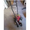 Image 1 : TROYBUILT SMALL GAS POWERED EDGER, NEEDS NEW FUEL PICKUP LINE, RUNS