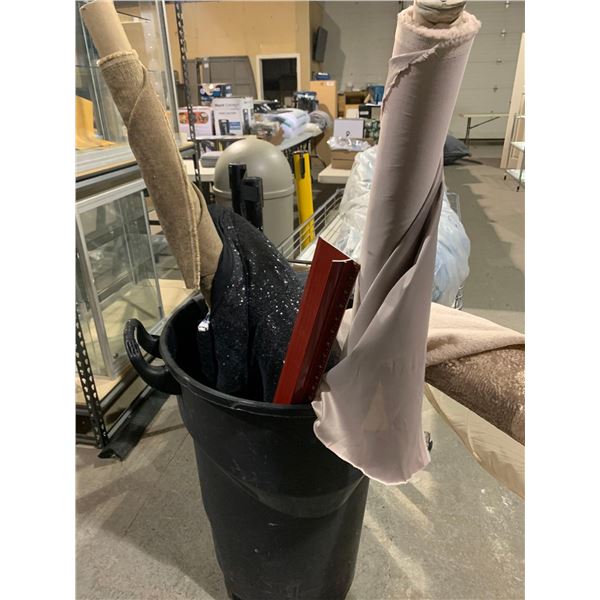 Lot of assorted bolts of fabric and rolling bin
