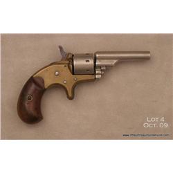 Colt model 1872 open-top 22 cal.  S.A. revolver,  nickle-plated serial #27315.  The Colt shows an  o