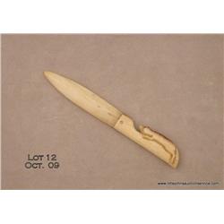 Hand carved whale ivory letter opener, approx.  7-1/2” overall with carved handle in the form of a  