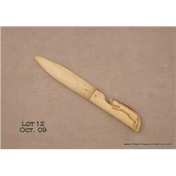 Hand carved whale ivory letter opener, approx.  7-1/2” overall with carved handle in the form of a  