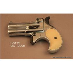 RG O/U derringer, .22 Magnum cal., 3” barrels,  nickel finish, checkered faux ivory grips, #9054.  T