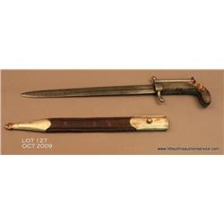 The only known example of a double barrel  percussion knife pistol with original scabbard,  circa 18