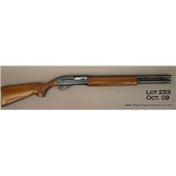 Remington Model 1100 semi-auto shotgun, 12 gauge,  20” barrel, blue finish, checkered wood stocks,
