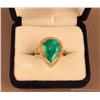 Image 1 : One two tone custom designed ladies emerald and  diamond ring set with one 6.95 ct pear shape  emera