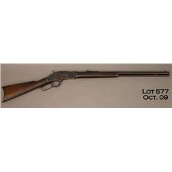 Winchester Model 1873 lever action rifle, .32  cal., 24” round barrel, blue finish, wood stocks,  #2