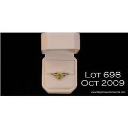 Very high quality 14 karat yellow gold ballerina  design ring set with a MQ peridot and surrounded  