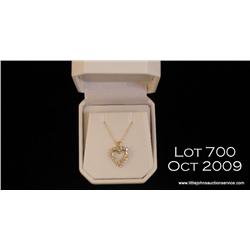 Dazzling 14 karat yellow gold ladies heart design  necklace set with round diamonds weighing approx.