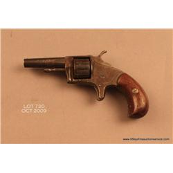 Blue Jacket spur trigger revolver, .22 cal., 2”  barrel, blue finish, wood grips, #NVSN. This gun  i