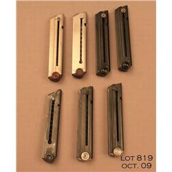 Lot of 7 Luger magazines, one Erma .22 cal., two  plastic base, two aluminum base, and two wooden  b