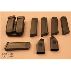 Misc lot of 7 Glock pistol magazines including  five 10 mm magazines with two loading assisters  and