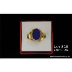 18kt yellow gold ring 14 grams set with one oval  lapis stone.  Est. $300 - $600