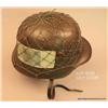 Image 1 : German WW II helmet with green cord netting intact  and a German 10 Mark paper currency held under  
