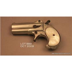 Remington O/U derringer, .41 cal., 3” barrels,  nickel finish, thick pearl grips, #923. This gun  is