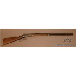 Winchester Model 1894 lever action rifle, 30 WCF  cal., 26” octagon barrel, blue finish, plain wood