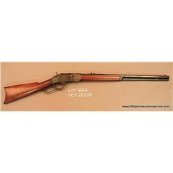 Winchester Model 1873 lever action rifle, .38 WCF  cal., 24” octagon barrel, blue finish, plain wood