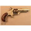 Image 1 : REMINGTON Smoot No. 1, # 671, .30 cal., nickel  finish, smooth wood grips.  Revolver remains in  goo