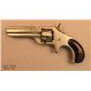 Image 2 : REMINGTON Smoot No. 1, # 671, .30 cal., nickel  finish, smooth wood grips.  Revolver remains in  goo