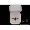 Image 1 : Dazzling 10karat white gold ladies ring set with a  center oval red ruby weighing approx. 2.50 carat