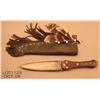 Image 1 : Large modern made Indian dag style knife and  leather sheath with feathers, beads and small  brass b