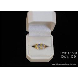 Elegant 10 karat yellow gold ladies ring set with  13 oval blue and yellow sapphires weighing approx