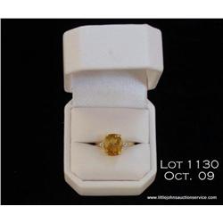 Fashionable 10 karat yellow gold ladies ring set  with an intense color orange citrine weighing 4.25
