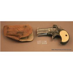 FIE O/U derringer, .38 cal., 3” barrels, nickel  finish to barrels, faux ivory checkered grips,  #04