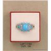 Image 1 : Vibrant 14 karat white gold ladies ring set with a  fine combination of tanzanite and turquoise  wei
