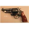 Image 2 : Smith & Wesson Registered Model DA revolver, .357  Magnum cal., 4” barrel, blue finish, checkered  m