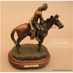 Bronze statue on wood base by Ace Powell titled  “Tracker” showing an Indian on his horse, approx.  