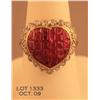 Image 1 : One 18k yellow gold heart shaped ladies ring set  with square cut rubies and diamonds. Square cut  r