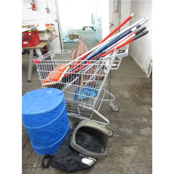 Shopping cart with copper sailboat wall hanger, storage bags, mops