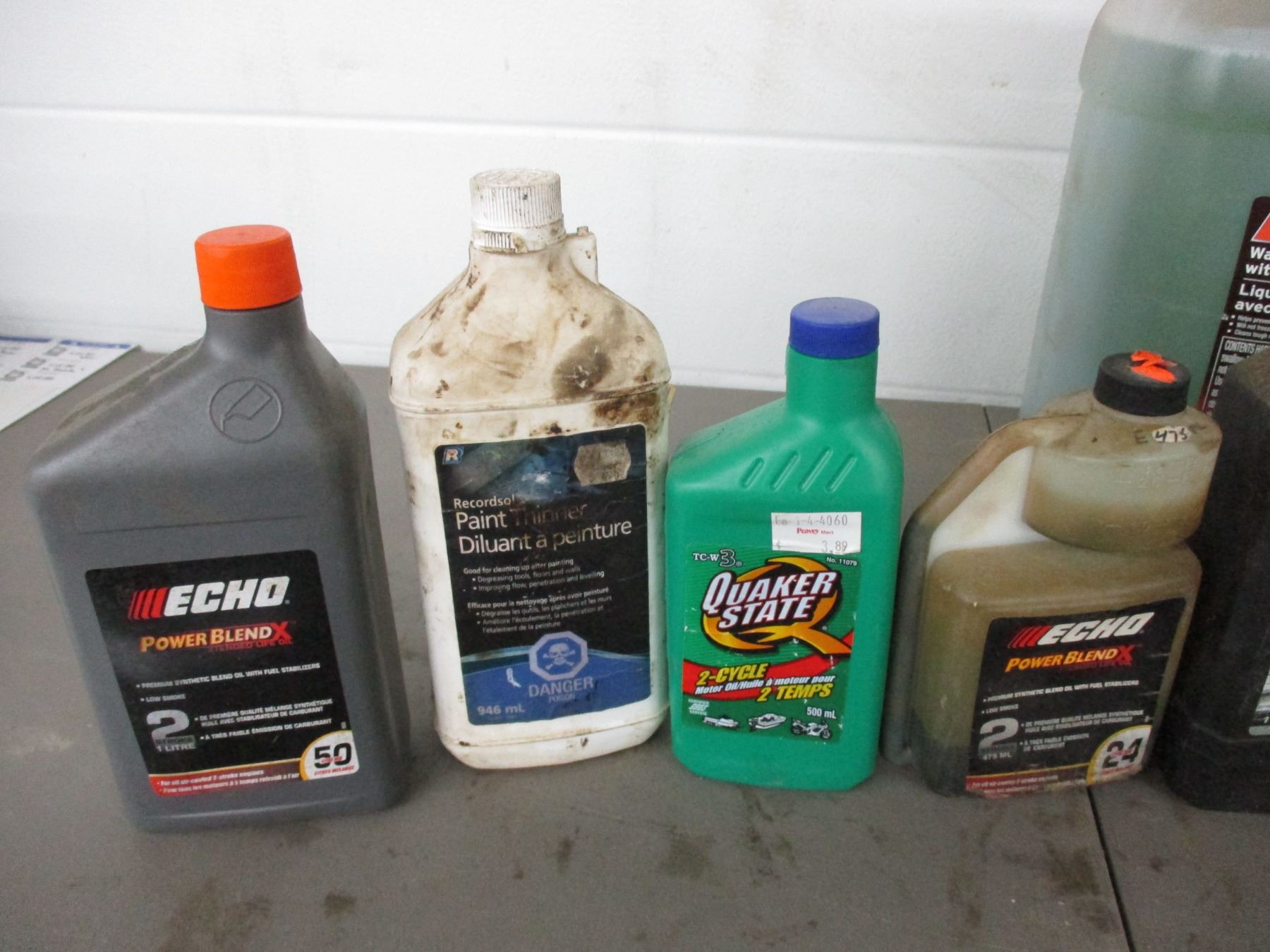 Partial containers with oil, antifreeze, washer fluid