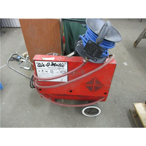 Airomatic heavy duty air compressor (needs repair) with hose + reel