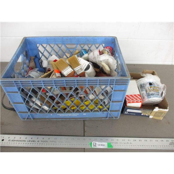Plastic crate with painting supplies