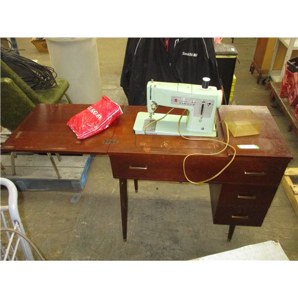 Wooden sewing machine cabinet with singer machine + sewing related