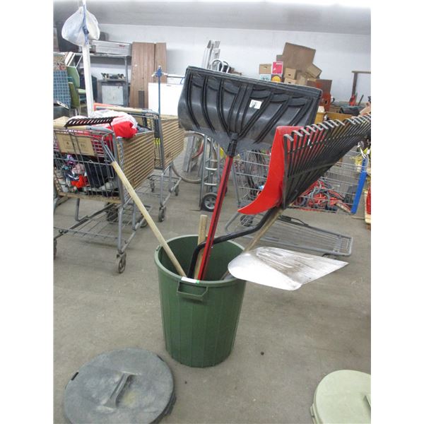 Garbage can with 2 rakes, sledgehammer, aluminum shovel, 2 snow shovels